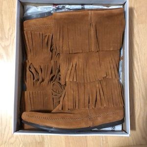 Brown suede Minnetonka fringe boots.